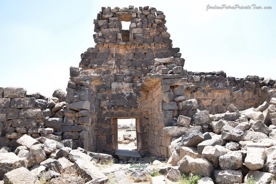 Ancient ruins of Umm Al-Jimal, Jordan, featuring black basalt stone structures